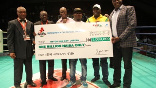 GOtv Boxing Night winner Ottoh with cheque